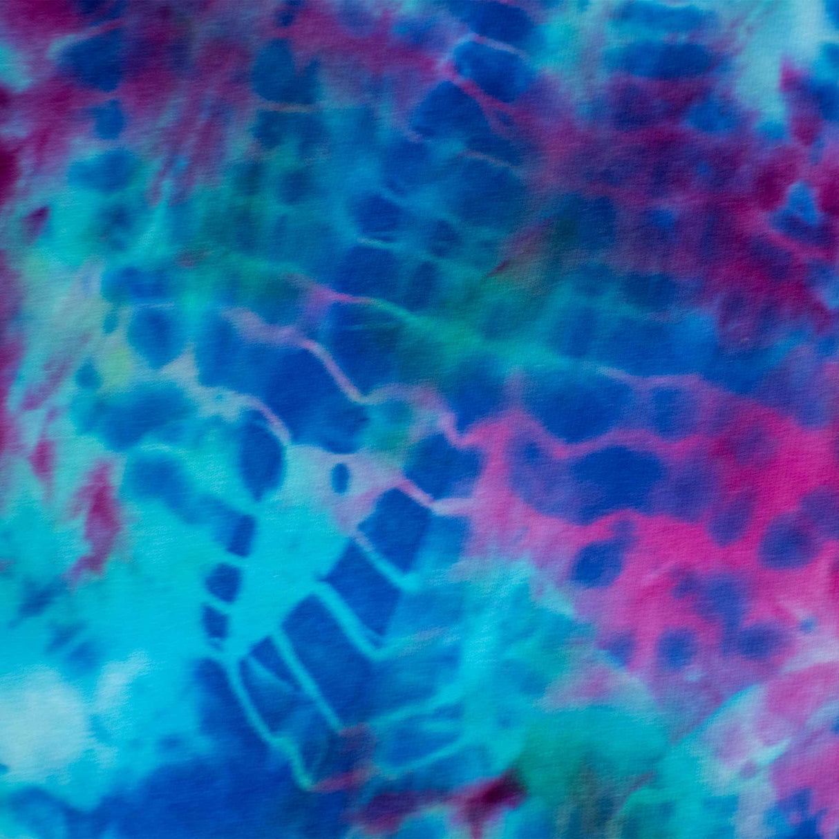 This long sleeve shirt boasts a bold tie-dye pattern with deep blues and bright pinks, reminiscent of a cosmic nebula.
