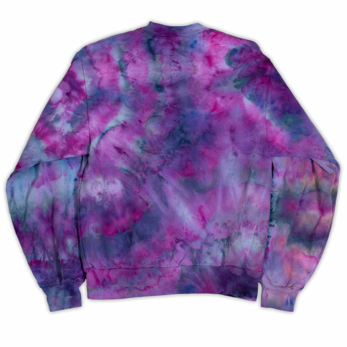A tie-dye sweatshirt showcases a vibrant pattern of purples and blues, with colors merging fluidly. The ribbed cuffs and hem indicate a cozy and comfortable design.