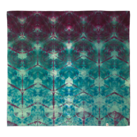 A square fabric bandana featuring a symmetrical tie-dye pattern in teal, turquoise, and deep magenta-purple, displayed flat against a white background.